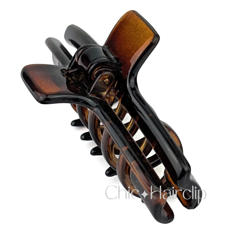 Pince cheveux originale Fabriquée en France, couleur écaille. Matière plastique de qualité.